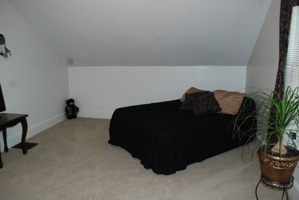 one of three bedrooms on upper level