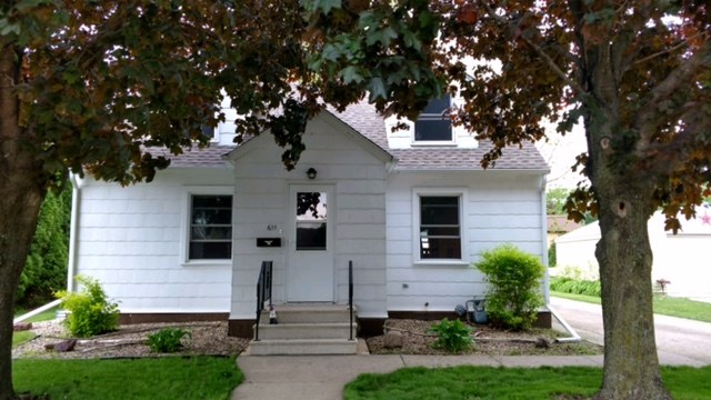 very cozy three bedroom home w/ double detached garage