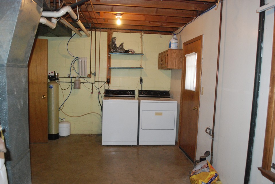 utility room/laundry room walk out to backyard