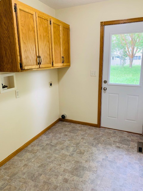 laundry area with access to backyard