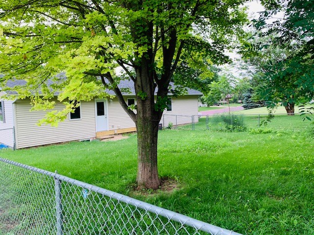 fenced area on backside of home