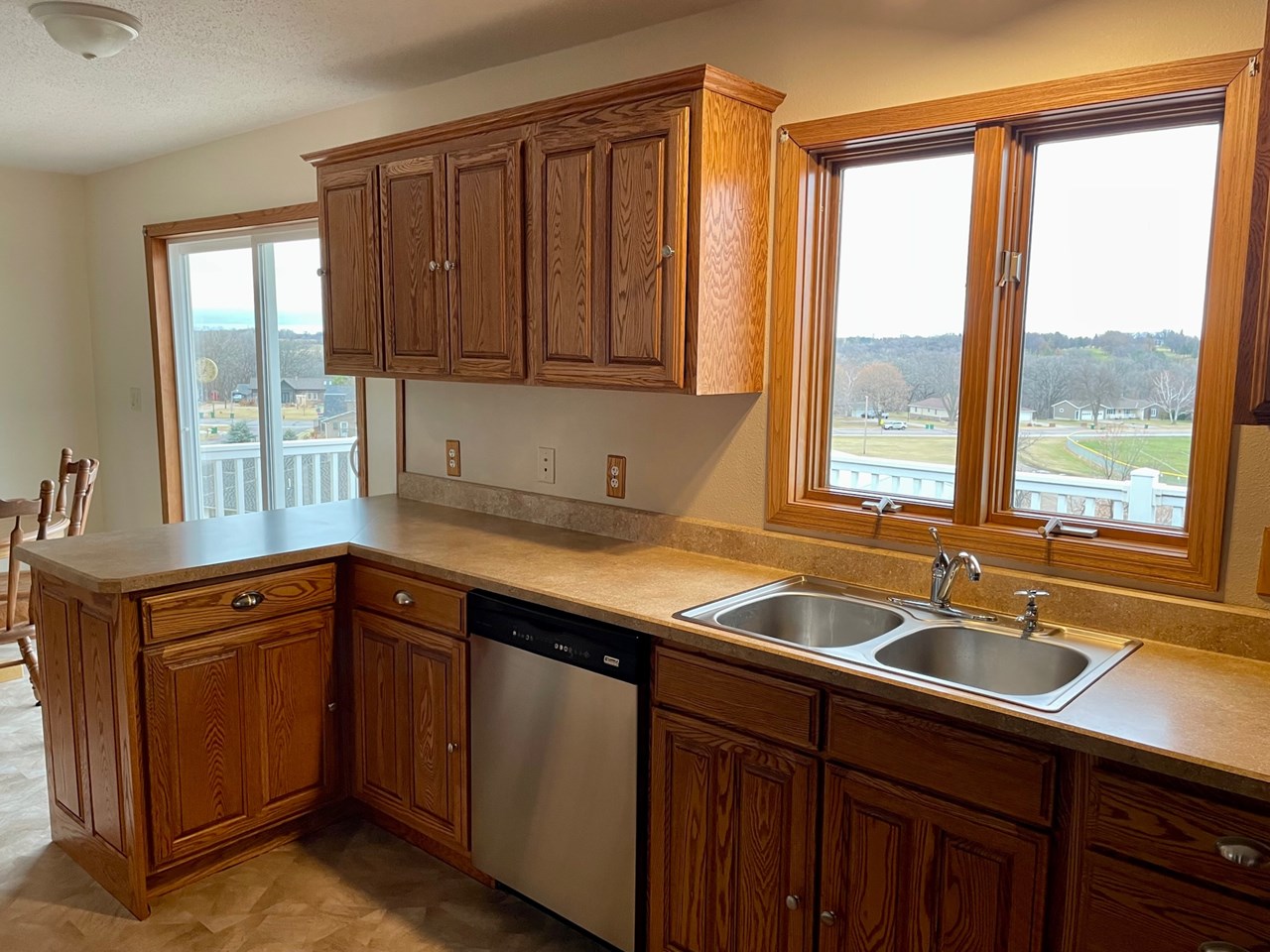 nice oak cupboards and stainless steel appliances