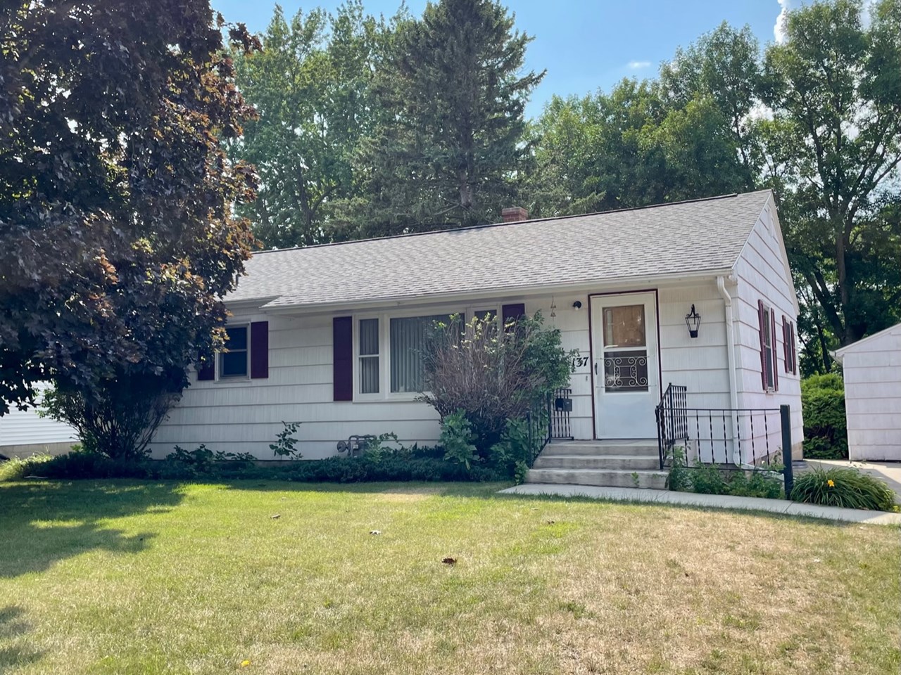 three bedroom ranch style home with detached single garage