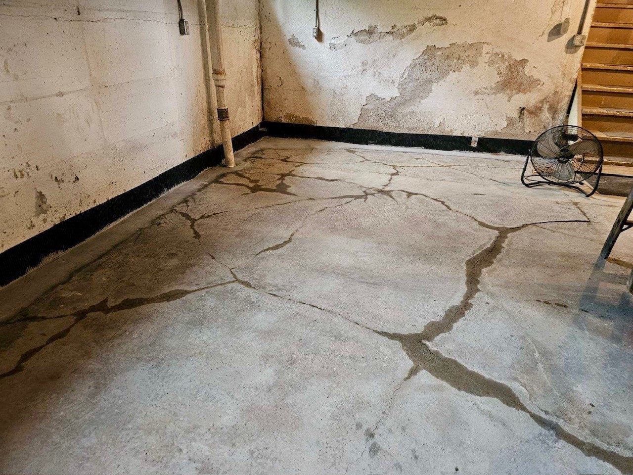 basement recently tiled around and sump pump added