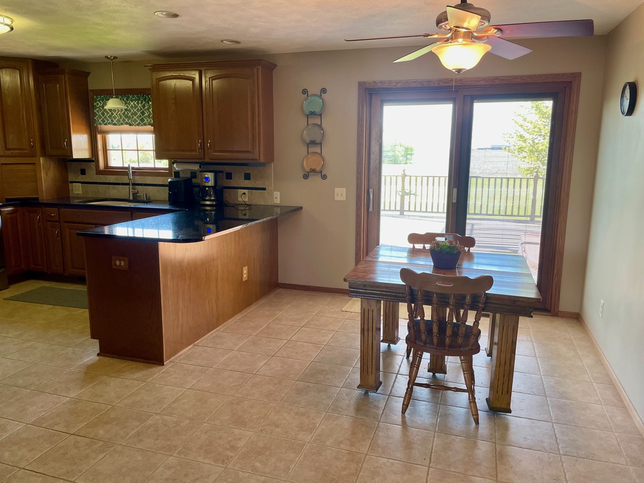 dining open to living room and access to deck