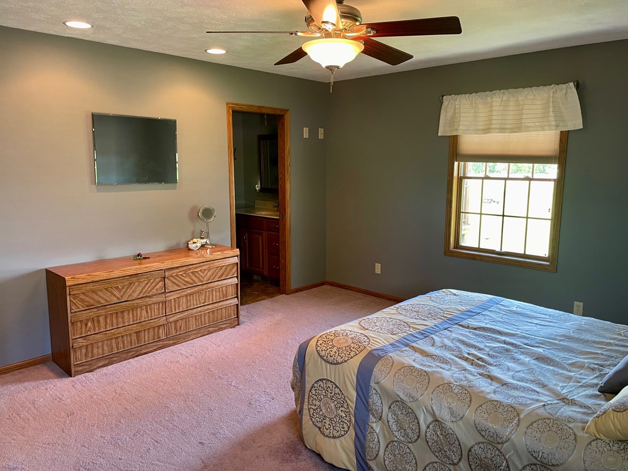 main bedroom with a walk-in closet and 3/4 bath