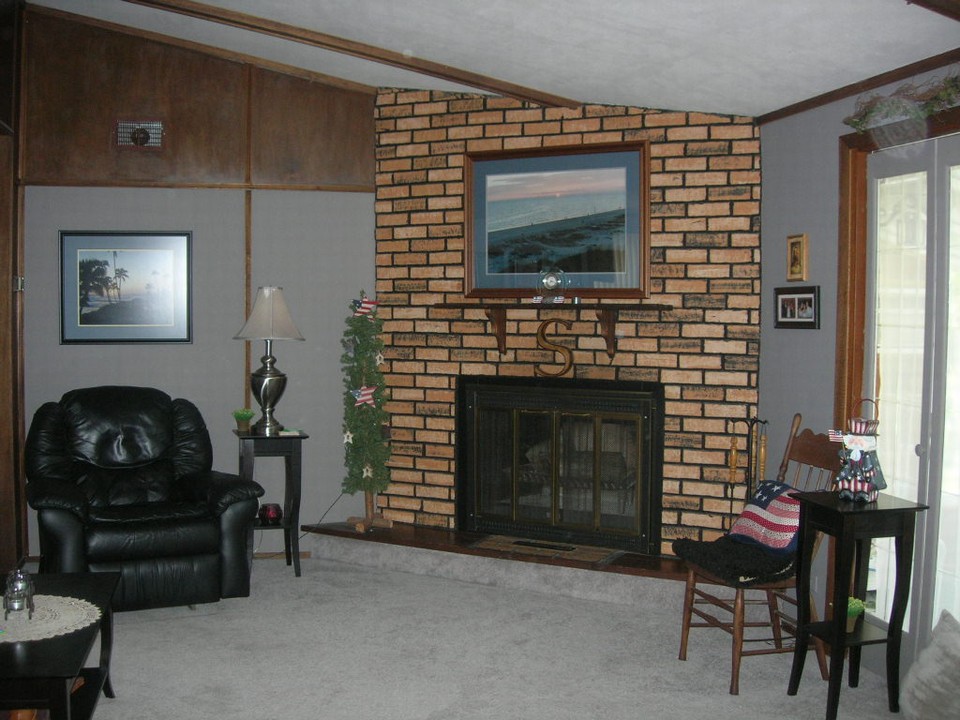 living room with  wood burning fireplace