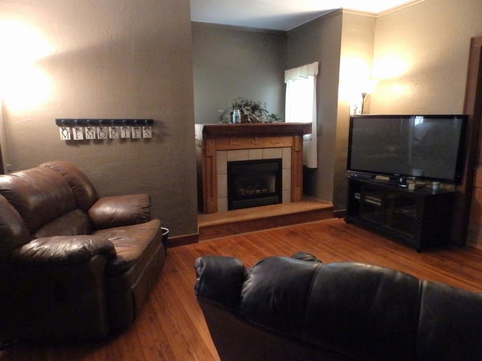 living room w/ kozy heat fireplace