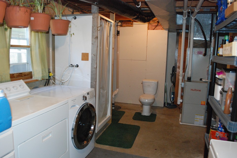 laundry, utility room and 3/4 bath on lower level