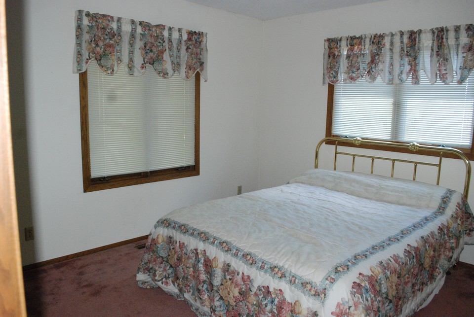 one of three bedrooms