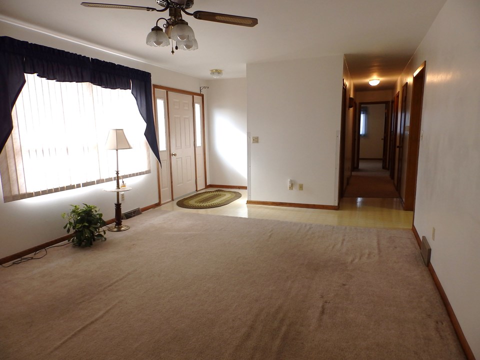 living room, front entry, hallway to bedrooms/ baths