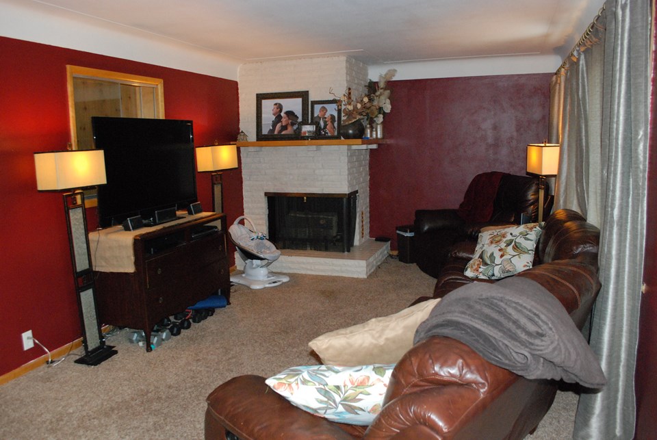 living room with fireplace-gas