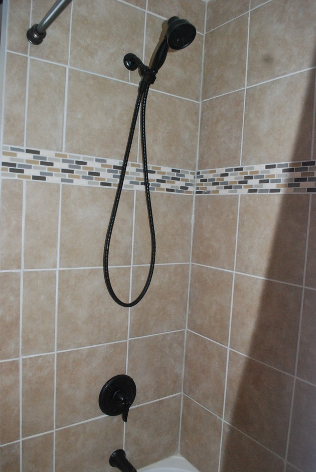 all new tile shower in main floor bathroom