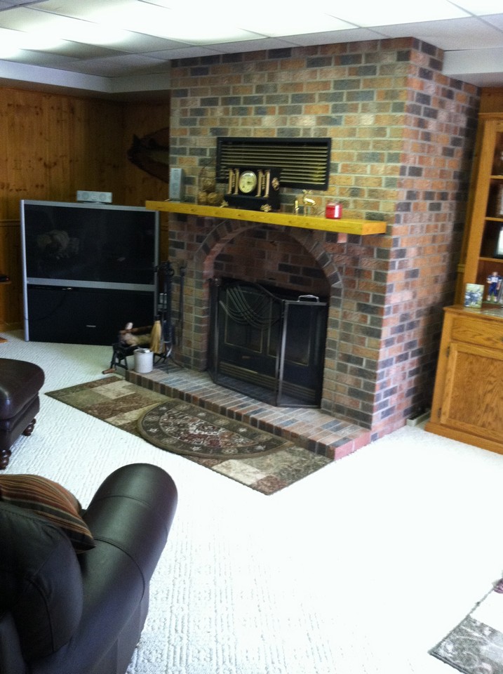 wood fireplace in lower level