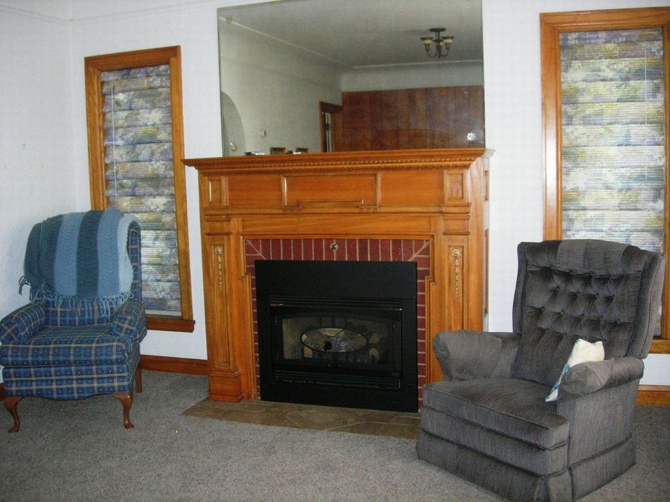 living room with kozy heat gas fireplace