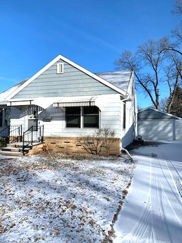 nice three bedroom home with a detached double garage close to downtown
