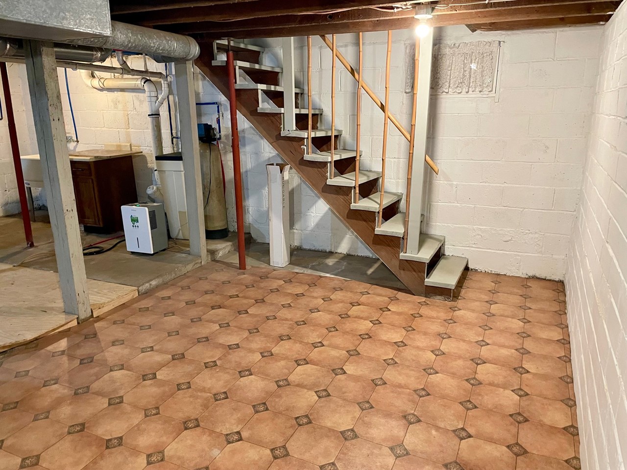 basement area with laundry and access to backyard