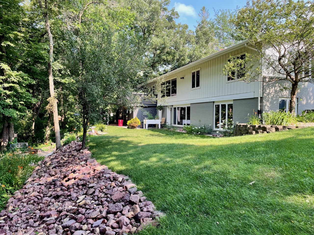 backside of house view...lot does go down to the des moines river