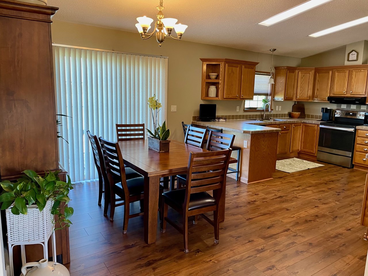 dining area open to kitchen with patio area to the west