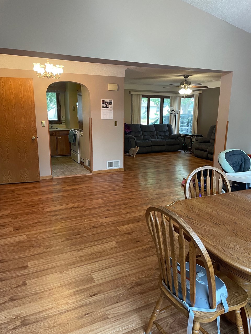 dining area open to living room and deck