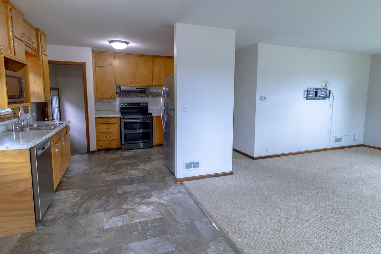 opens to kitchen/dining space